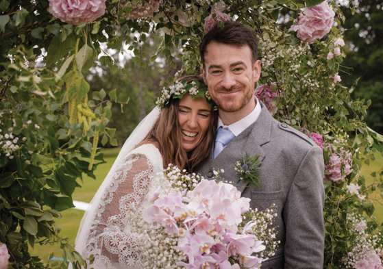 A Bride And Groom In Garden At Raemoir House