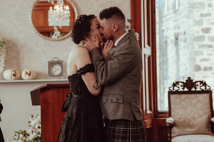 Bride and groom kiss at the end of their ceremony