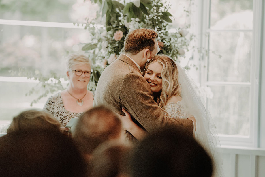 Bride and groom hugging