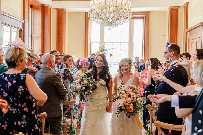 Brides walk up the aisle as newlyweds