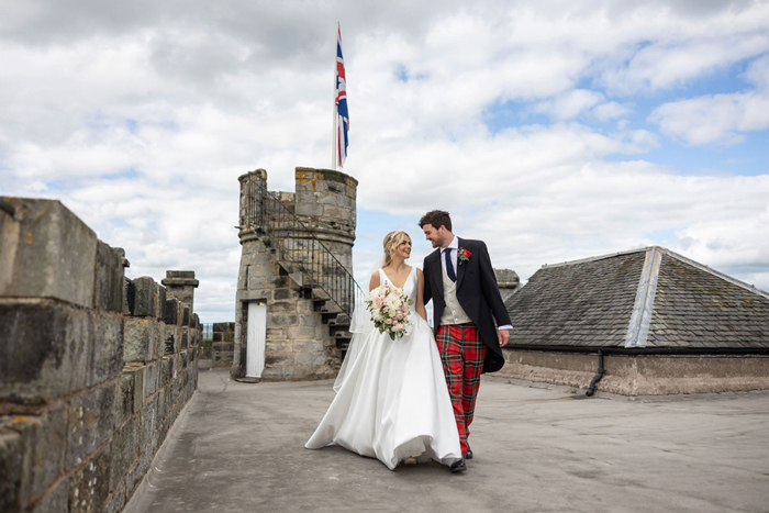 Couple walk towards camera during outdoor portraits