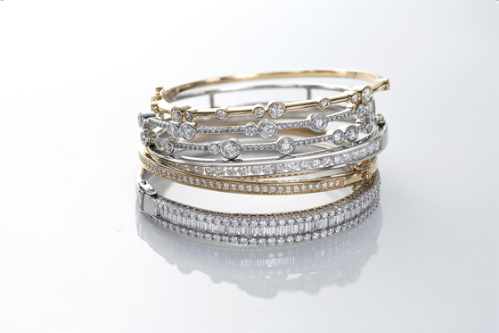 Gold and silver wedding bands stacked on top of each other