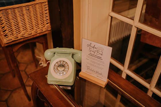 Audio Guest Book sign asking to leave a message with sage green Calleo telephone