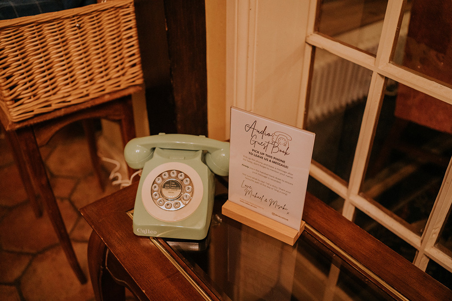 Audio Guest Book sign asking to leave a message with sage green Calleo telephone