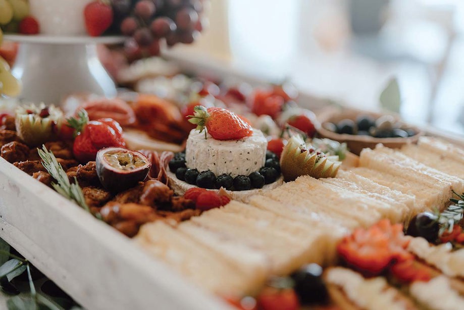 Small grazing board with cheeses and fruits 