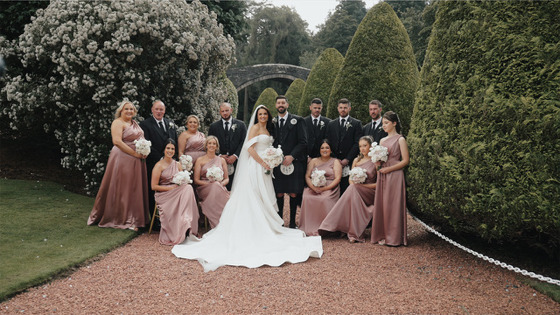 Bridal party and groomsmen pose together