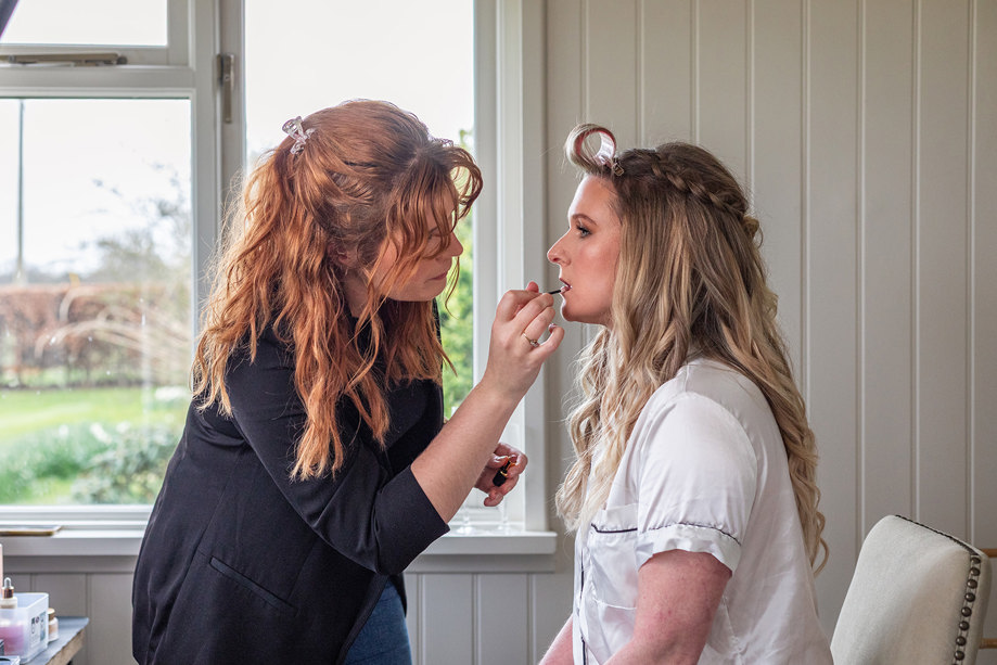 Jill Rowan Makeup applying lipstick