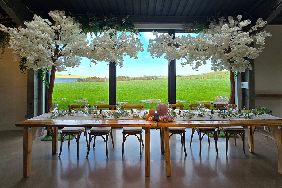 White floral tree decoration at top table