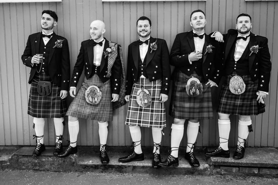 Black and white image of groom and his groomsmen