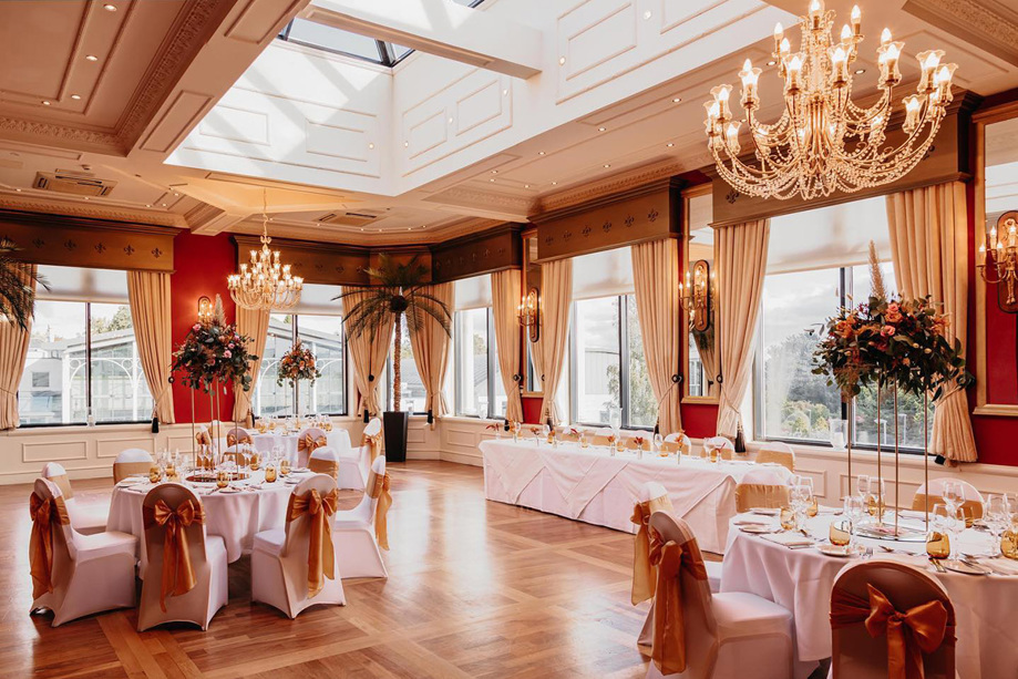 Wedding meal set up with chandeliers and flowers