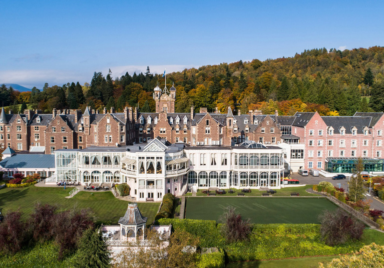 Crieff Hydro external view with grounds in foreground and hills in background