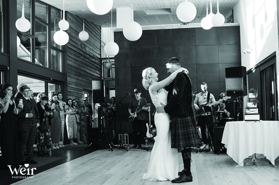 Black and white image of bride and groom's first dance by Weir Photography
