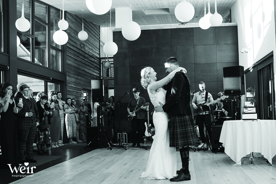 Black and white image of bride and groom's first dance by Weir Photography