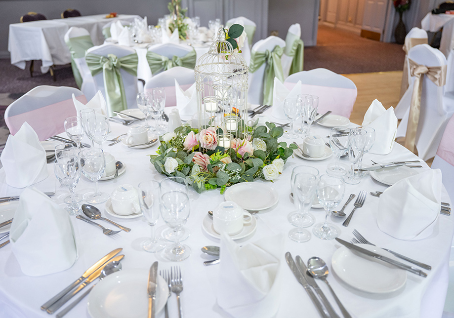 White table decor with baby pink roses