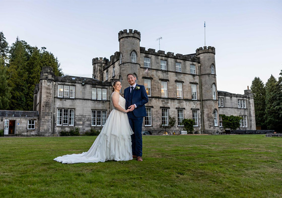 Bride and groom outside Melville Castle