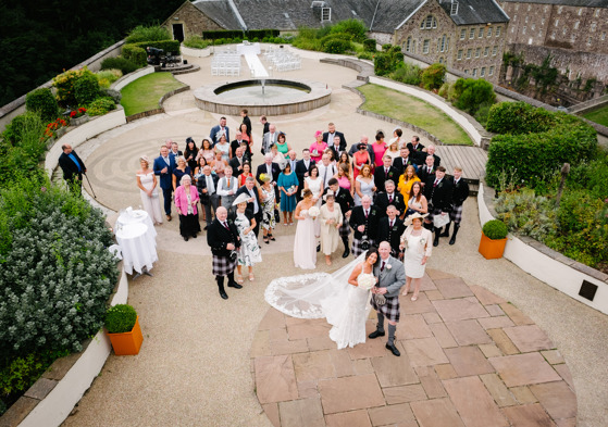 Wedding party look up to camera