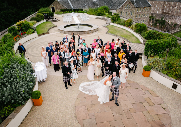 Wedding party look up to camera