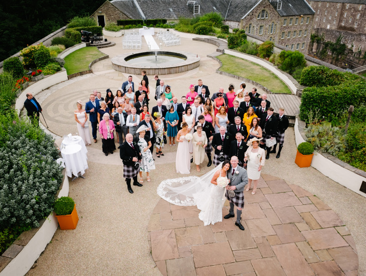 Wedding party look up to camera