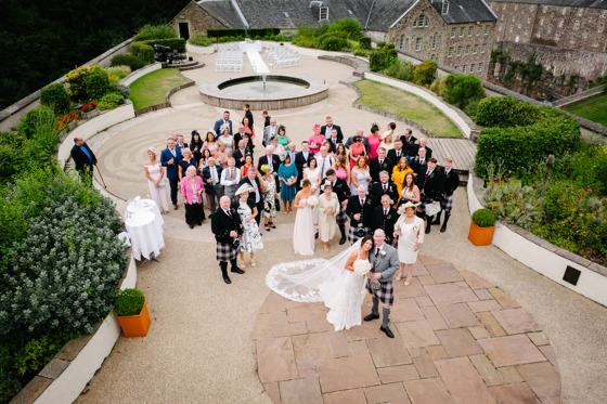 Wedding party look up to camera