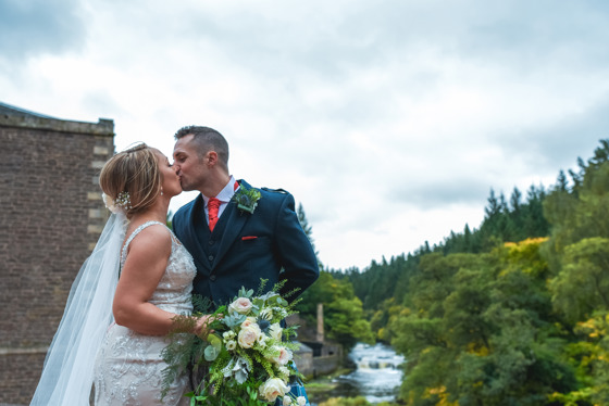 Bride and groom kiss