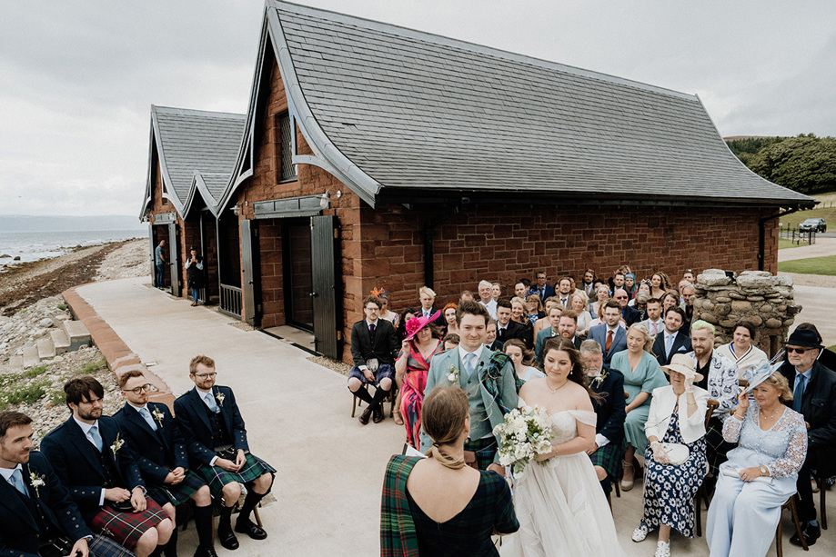 Ceremony outside the boathouse