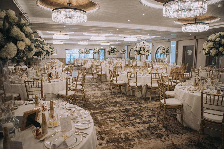 Wedding meal set up with bouquets of flowers on each table