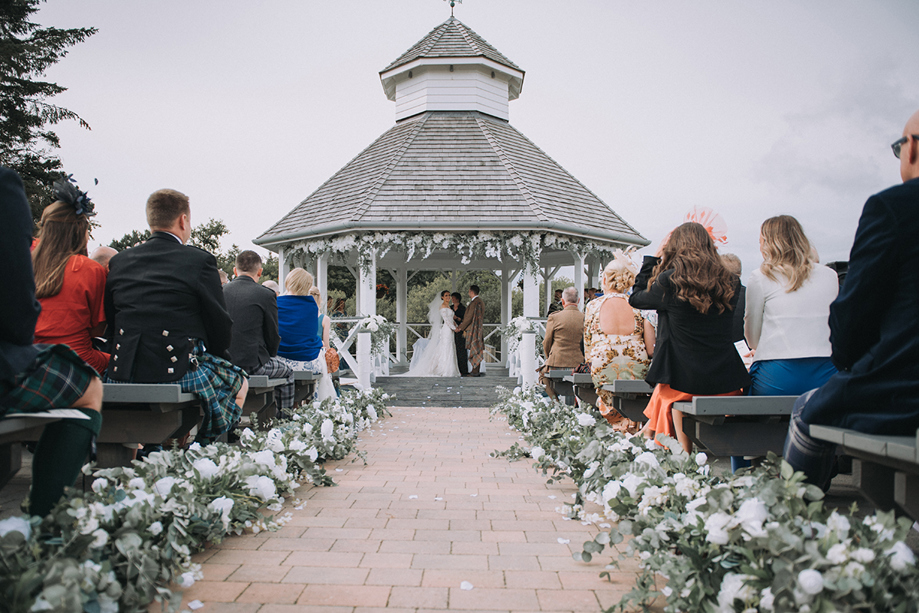 Bride and groom at altar under Pavilion